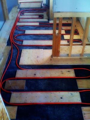 Radiant floor heating installation by Rescomm PHC Inc.